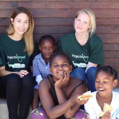 Teenagers spend time working with children during their volunteer project in South Africa Teenagers volunteering with children on one of Projects Abroad's programmes in South Africa